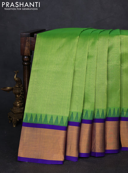 Kuppadam silk cotton saree parrot green and violet with plain body and temple design zari woven border