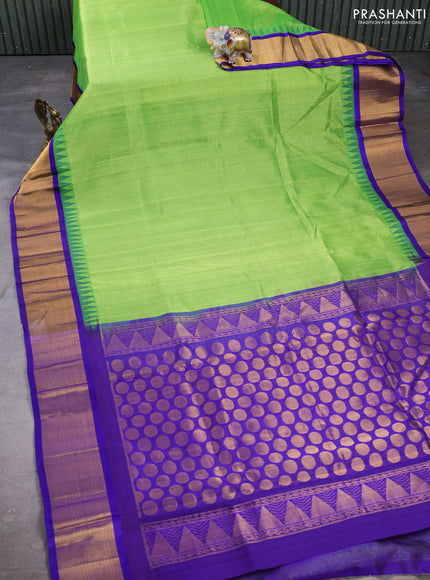 Kuppadam silk cotton saree parrot green and violet with plain body and temple design zari woven border