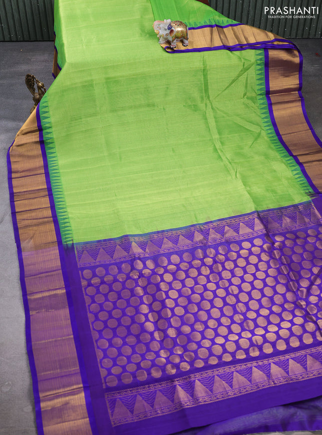 Kuppadam silk cotton saree parrot green and violet with plain body and temple design zari woven border