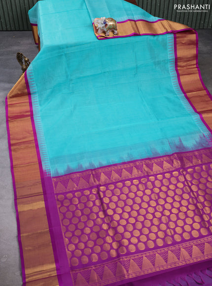 Kuppadam silk cotton saree teal blue and purple with plain body and temple design zari woven border