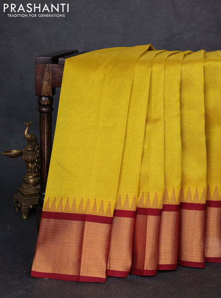 Kuppadam silk cotton saree lime yellow and maroon with plain body and temple design zari woven border