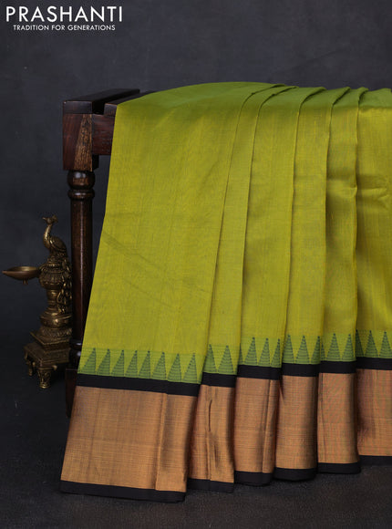 Kuppadam silk cotton saree light green and black with plain body and temple design zari woven border