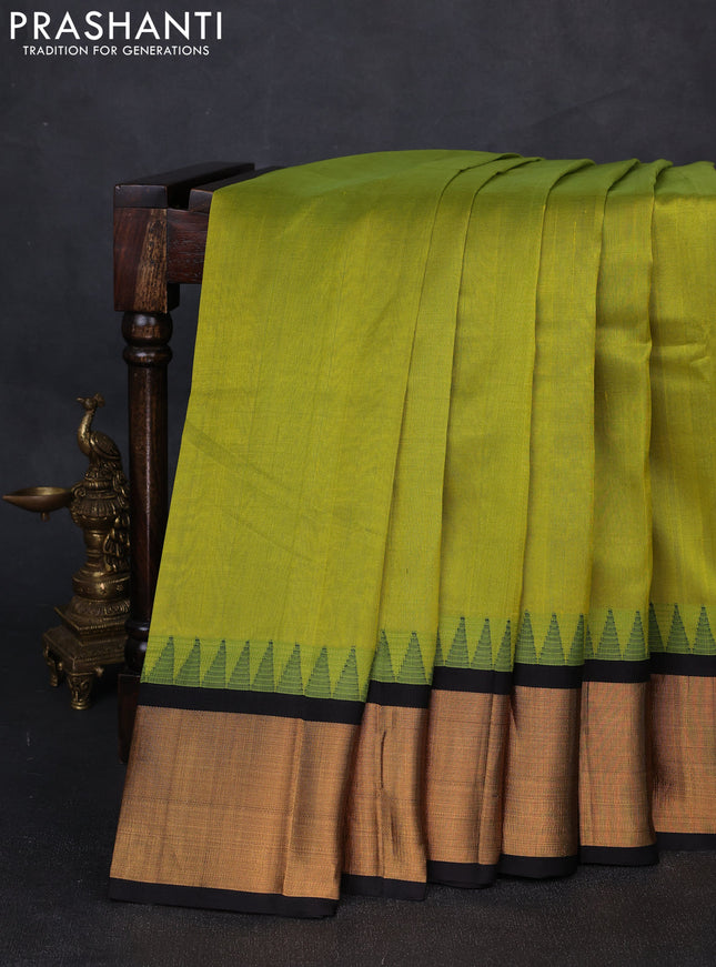 Kuppadam silk cotton saree light green and black with plain body and temple design zari woven border