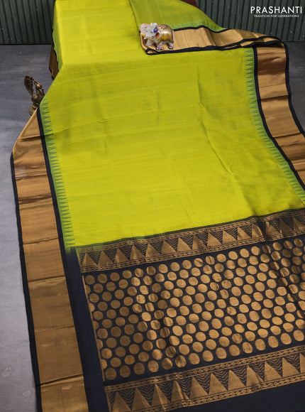 Kuppadam silk cotton saree light green and black with plain body and temple design zari woven border