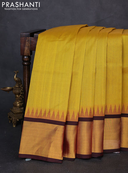 Kuppadam silk cotton saree mustard yellow and maroon with plain body and temple design zari woven border