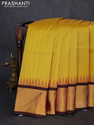 Kuppadam silk cotton saree mustard yellow and maroon with plain body and temple design zari woven border