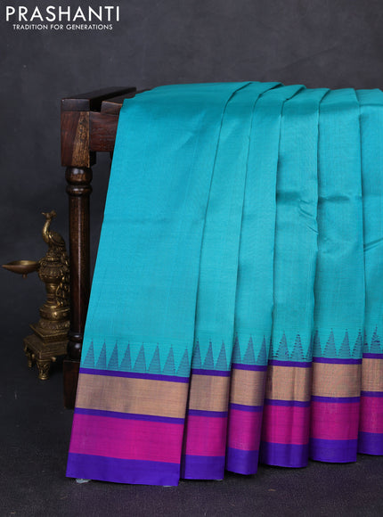 Kuppadam silk cotton saree teal blue and violet shade with plain body and temple design zari woven simple border