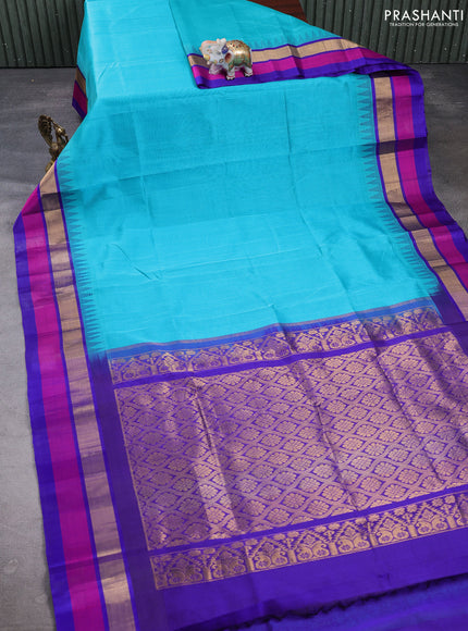 Kuppadam silk cotton saree teal blue and violet shade with plain body and temple design zari woven simple border