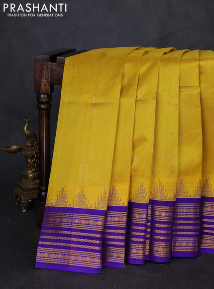 Kuppadam silk cotton saree yellow and violet shade with zari woven buttas and temple design zari woven border