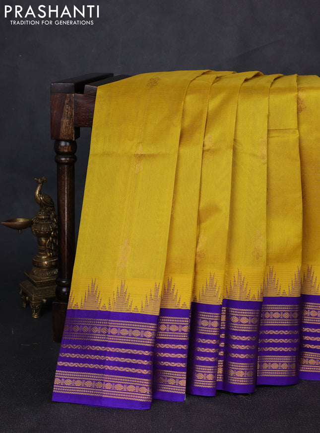Kuppadam silk cotton saree yellow and violet shade with zari woven buttas and temple design zari woven border
