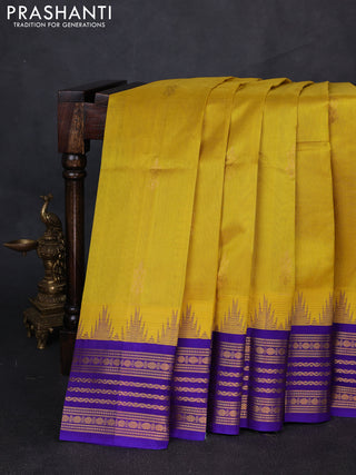 Kuppadam silk cotton saree yellow and violet shade with zari woven buttas and temple design zari woven border
