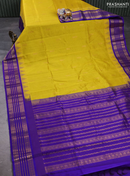 Kuppadam silk cotton saree yellow and violet shade with zari woven buttas and temple design zari woven border
