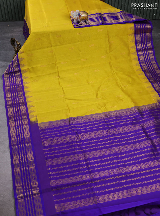 Kuppadam silk cotton saree yellow and violet shade with zari woven buttas and temple design zari woven border