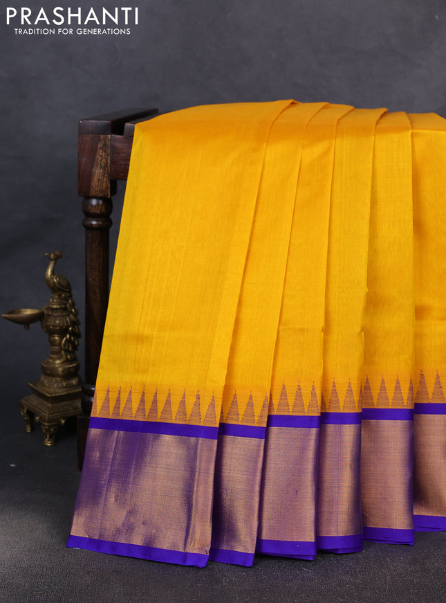Kuppadam silk cotton saree mango yellow and blue with plain body and temple design zari woven border