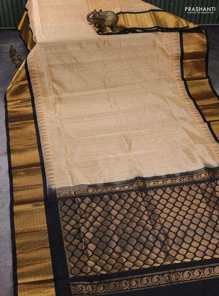 Kuppadam silk cotton saree sandal and black with plain body and temple design zari woven border