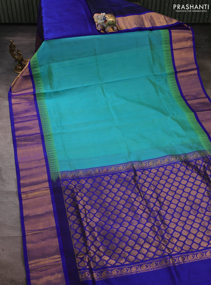Kuppadam silk cotton partly saree dual shade of teal bluish green and blue with plain body and temple design zari woven border