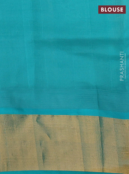 Kuppadam silk cotton saree cream and teal blue with plain body and temple design zari woven border