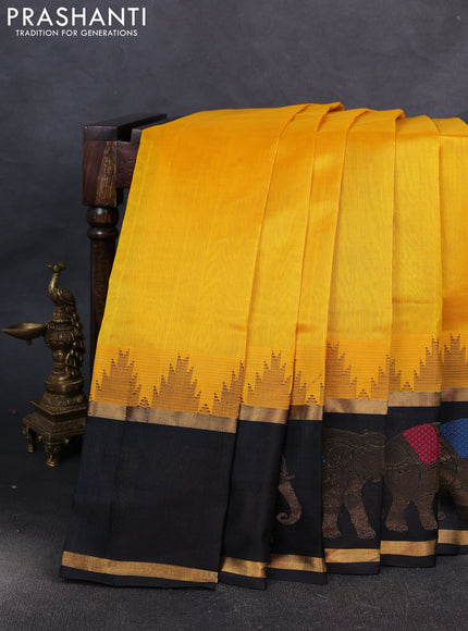 Kuppadam silk cotton saree mango yellow and black with plain body and temple design rettapet zari woven elephant butta border
