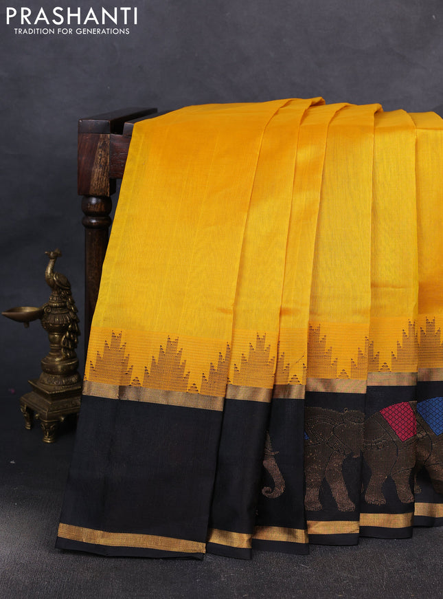 Kuppadam silk cotton saree mango yellow and black with plain body and temple design rettapet zari woven elephant butta border