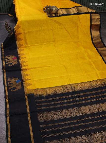 Kuppadam silk cotton saree mango yellow and black with plain body and temple design rettapet zari woven elephant butta border