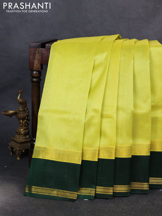 Kuppadam silk cotton saree lime yellow and bottle green with plain body and rettapet zari woven border