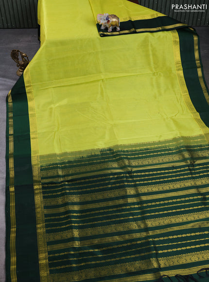 Kuppadam silk cotton saree lime yellow and bottle green with plain body and rettapet zari woven border