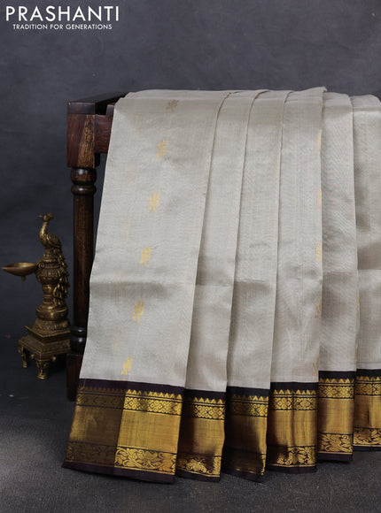 Kuppadam silk cotton saree pastel grey and coffee brown with allover zari woven buttas and zari woven border