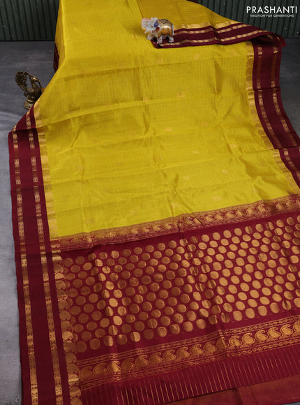 Kuppadam silk cotton saree yellow and maroon with allover zari checks & buttas and rettapet zari woven border