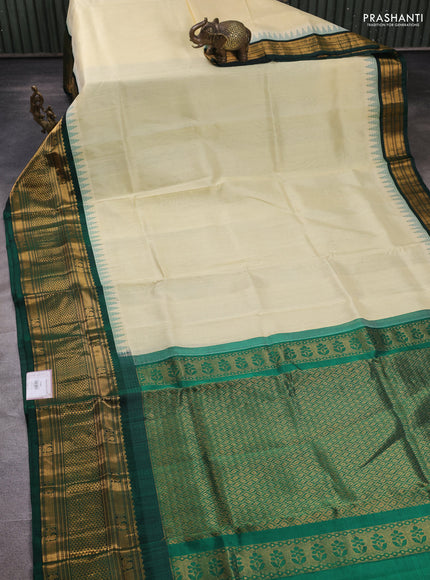 Kuppadam silk cotton saree cream and bottle green with plain body and temple design long zari woven border