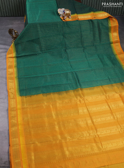 Kuppadam silk cotton saree green and mustard yellow with allover lakshadeepam pattern and temple design zari woven border