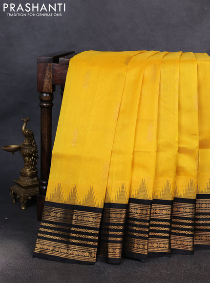 Kuppadam silk cotton saree mango yellow and black with zari woven buttas and temple design zari woven border