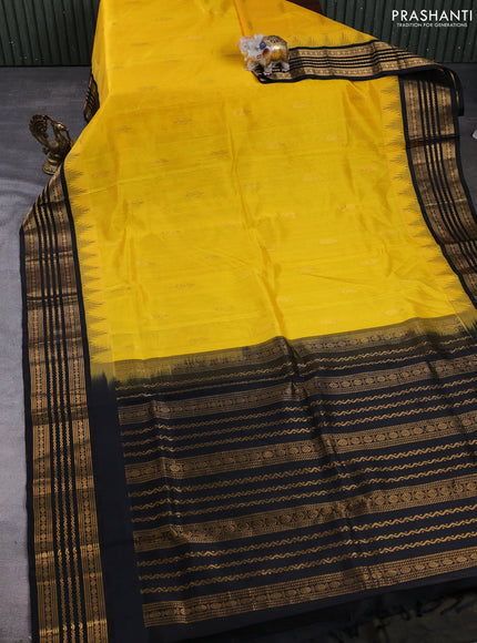 Kuppadam silk cotton saree mango yellow and black with zari woven buttas and temple design zari woven border
