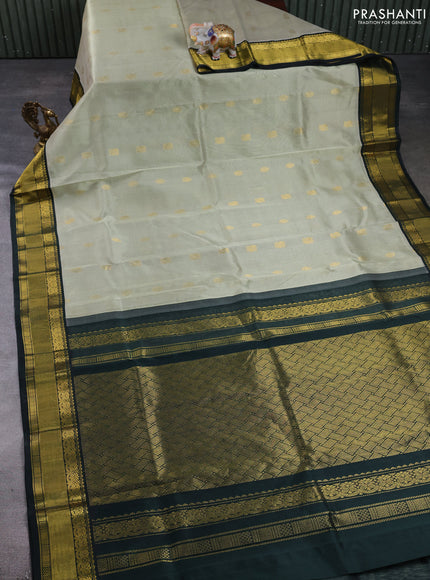 Kuppadam silk cotton saree pista green and bottle green with zari woven buttas and zari woven border