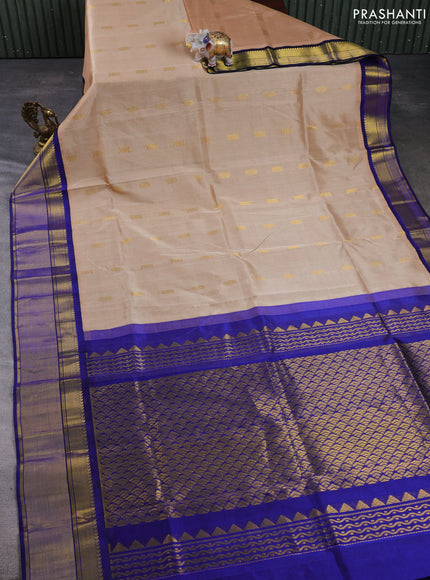 Kuppadam silk cotton saree sandal and blue with zari woven buttas and zari woven border
