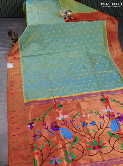Pure paithani silk saree dual shade of teal green and red with allover zari woven buttas and zari woven muniya butta border