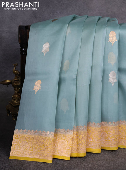 Banarasi organza saree pastel blue and yellow with zari woven buttas and zari woven border