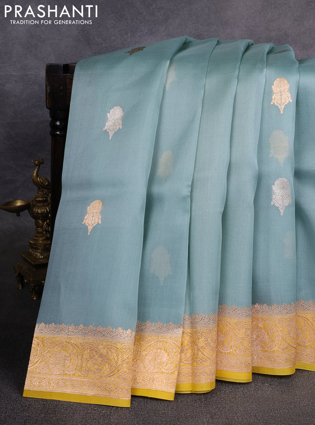 Banarasi organza saree pastel blue and yellow with zari woven buttas and zari woven border
