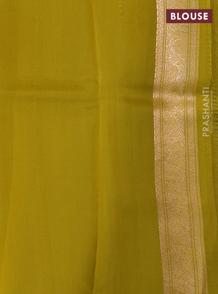 Banarasi organza saree pastel blue and yellow with zari woven buttas and zari woven border