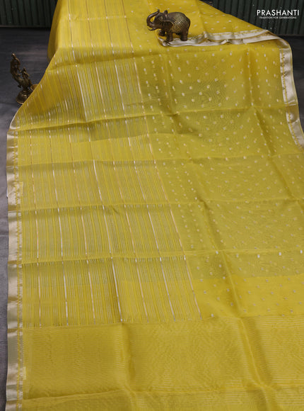 Banarasi organza saree lime yellow with allover zari stripes pattern and zari woven border