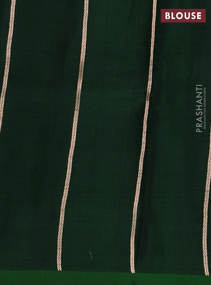 Banarasi organza saree dark green with zari woven buttas and satin border