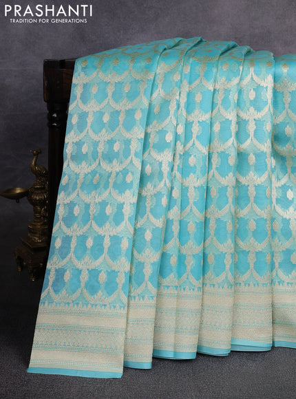 Banarasi organza saree teal blue with allover banarasi zari weaves and zari woven border