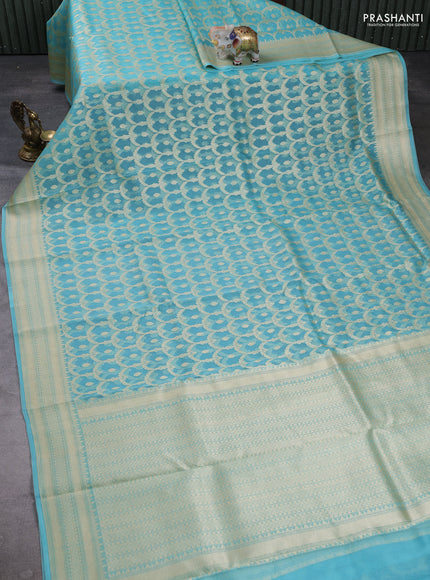 Banarasi organza saree teal blue with allover banarasi zari weaves and zari woven border