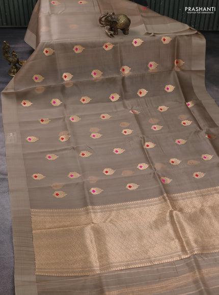 Banarasi organza saree beige with zari woven buttas in borderless style