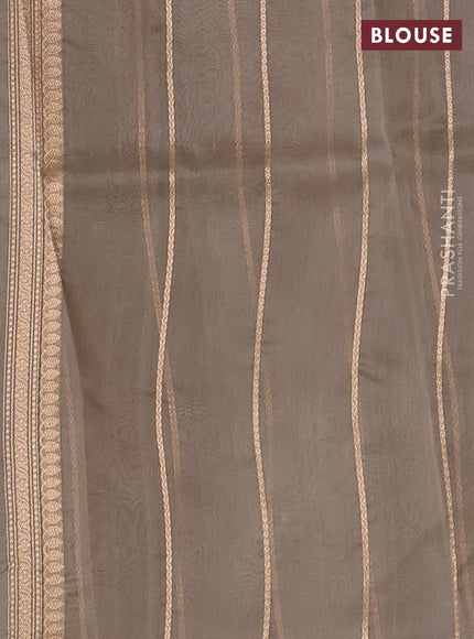 Banarasi organza saree beige with zari woven buttas in borderless style