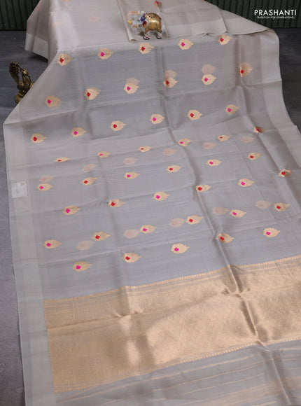 Banarasi organza saree grey with zari woven buttas in borderless style