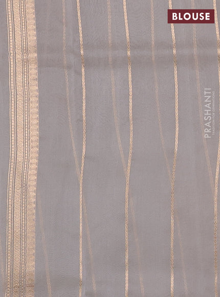 Banarasi organza saree grey with zari woven buttas in borderless style