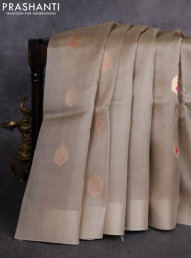 Banarasi organza saree beige with zari woven buttas in borderless style