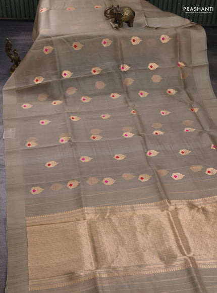 Banarasi organza saree beige with zari woven buttas in borderless style
