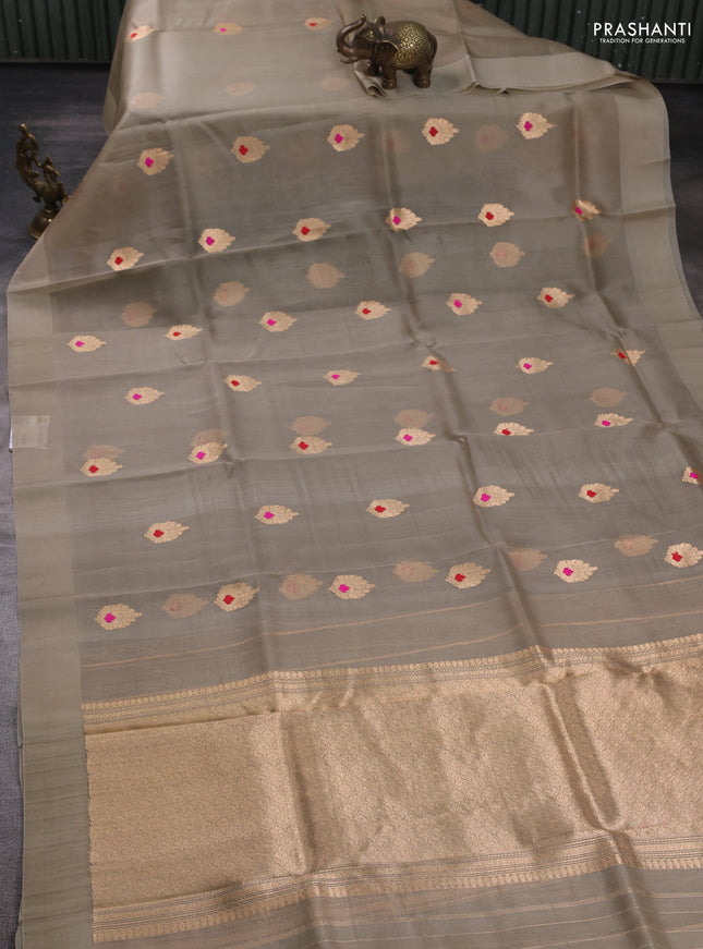 Banarasi organza saree beige with zari woven buttas in borderless style