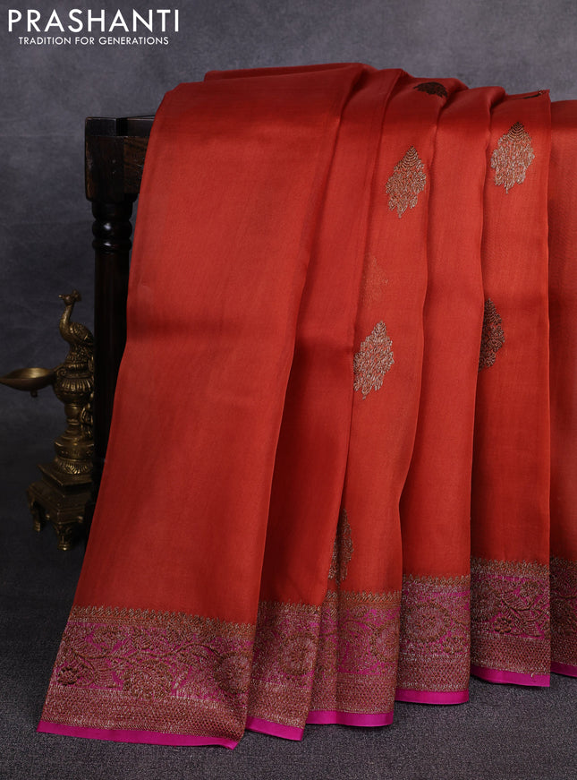 Banarasi organza saree orange and pink with woven buttas and banarasi style border